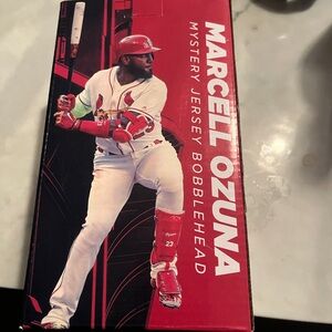 Marcel Ozuna mystery Jersey bobble head with green arm sleeve NIB